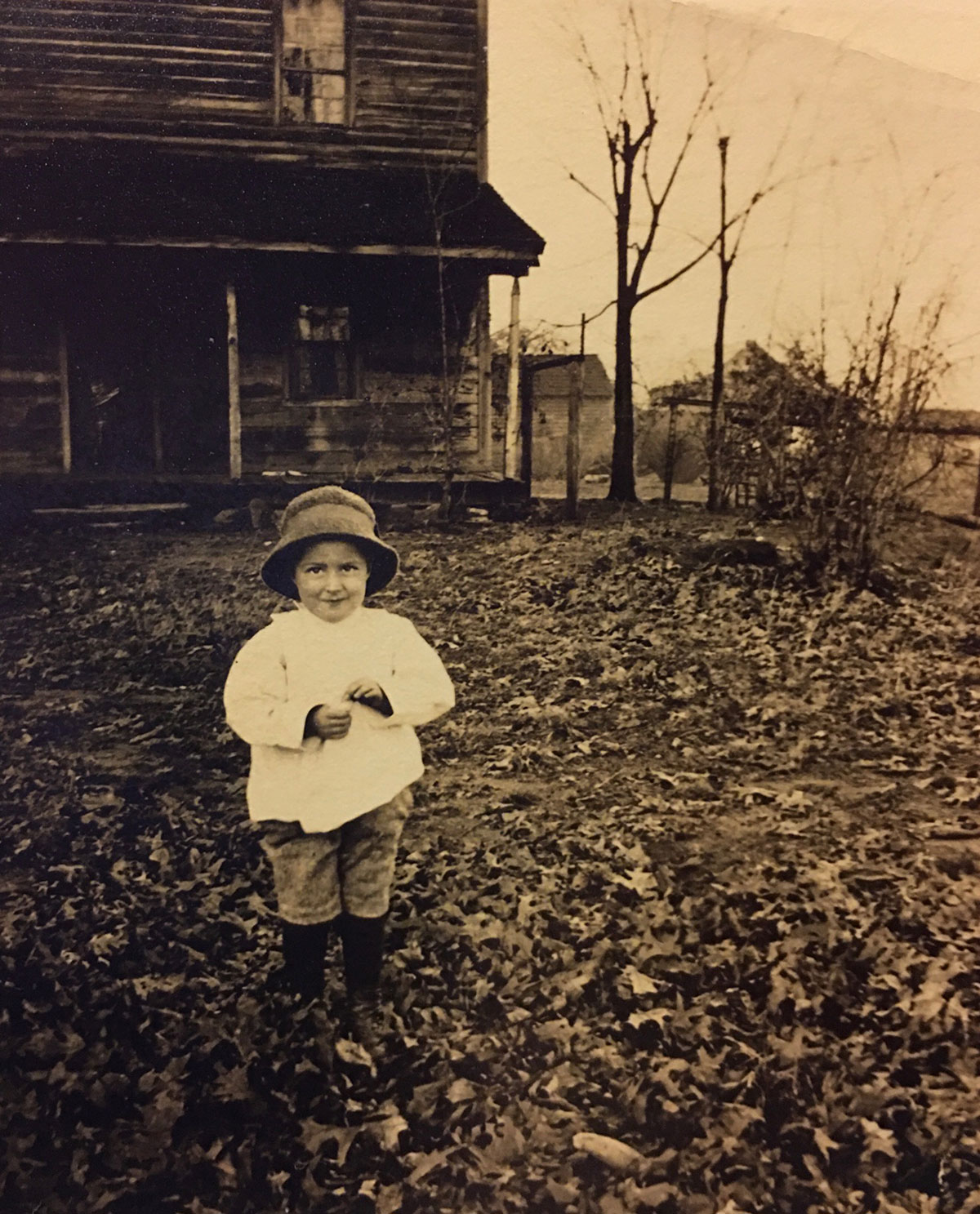 James Hall Sr. in front of house